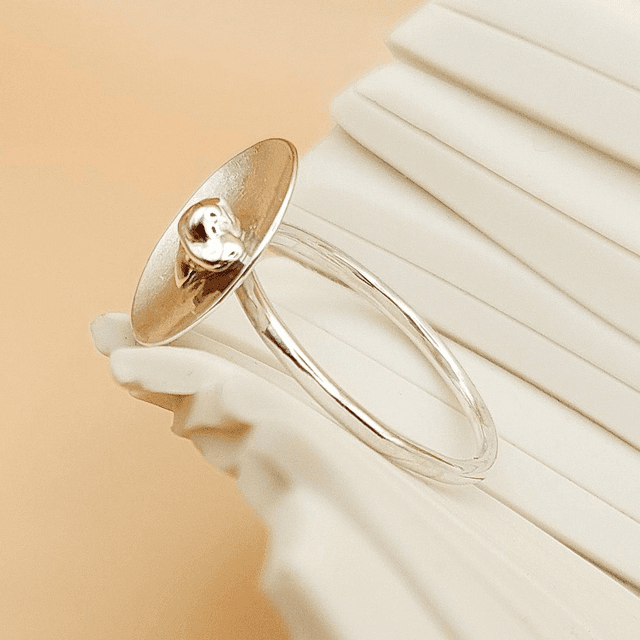Sterling silver satin finish domed disc ring with silver nugget