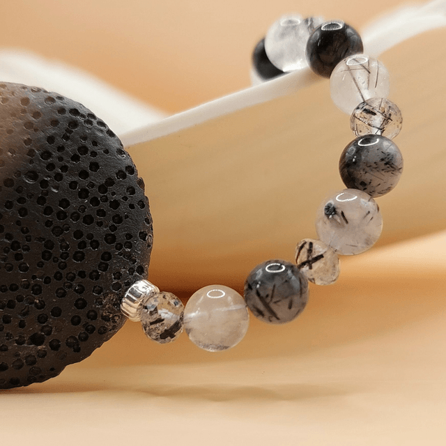 Lava (black), tourmalinated quartz and sterling silver beaded bracelet
