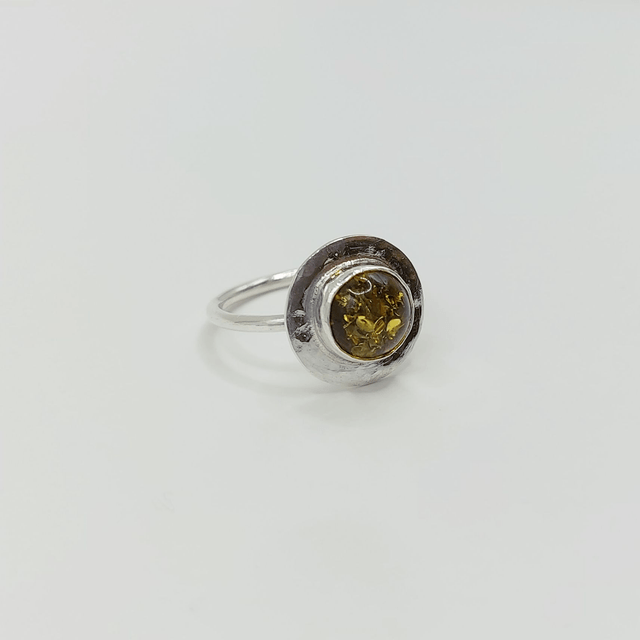 Sterling silver disc ring with green amber gemstone
