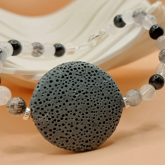 Lava (grey), tourmalinated quartz and sterling silver beaded bracelet