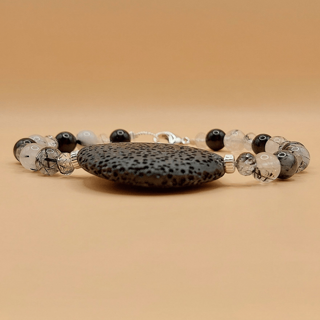 Lava (black), tourmalinated quartz and sterling silver beaded bracelet