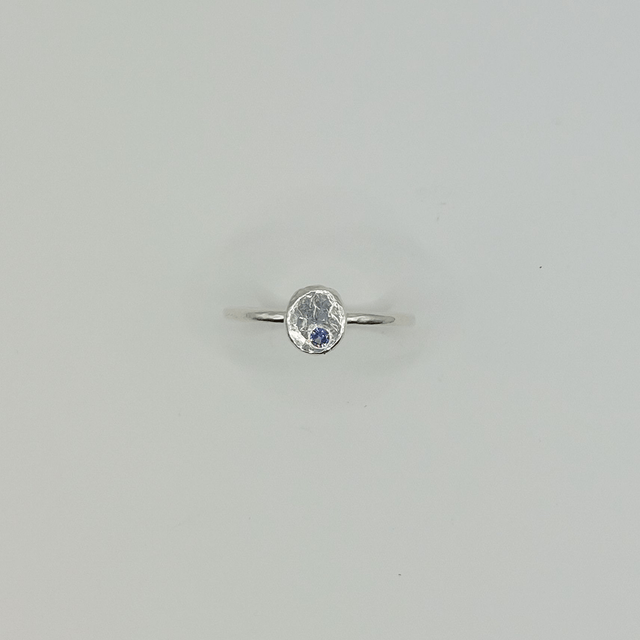 Hammered sterling silver disc ring with blue stone (size O)