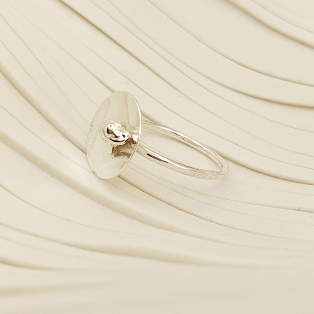 Sterling silver satin finish domed disc ring with silver nugget