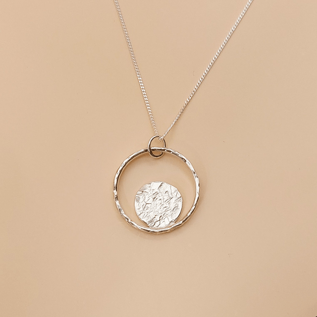 Sterling silver hammered ring with hammered disc necklace