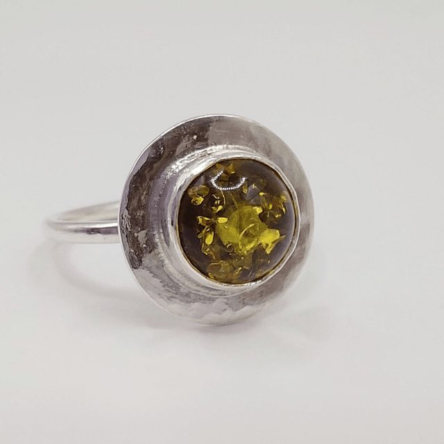 Sterling silver disc ring with green amber gemstone