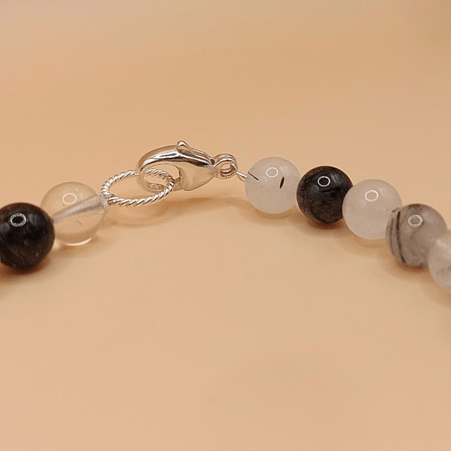 Lava (grey), tourmalinated quartz and sterling silver beaded bracelet