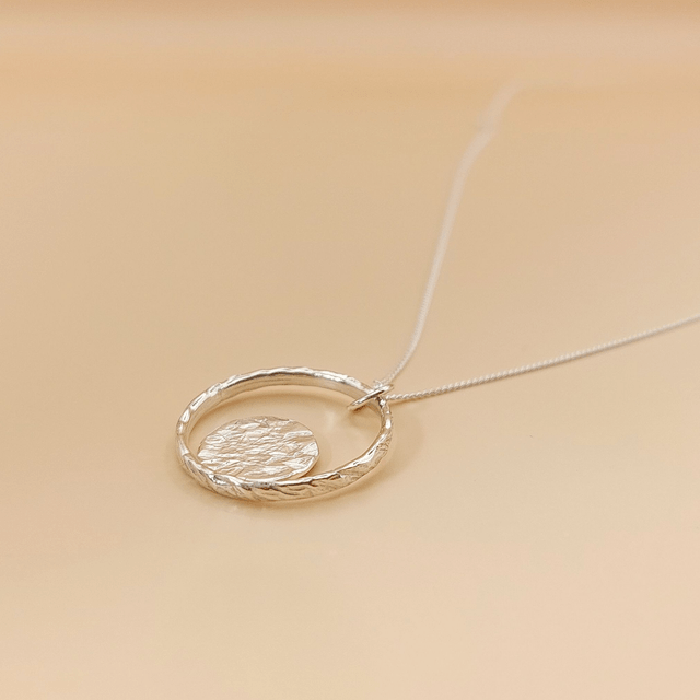 Sterling silver hammered ring with hammered disc necklace