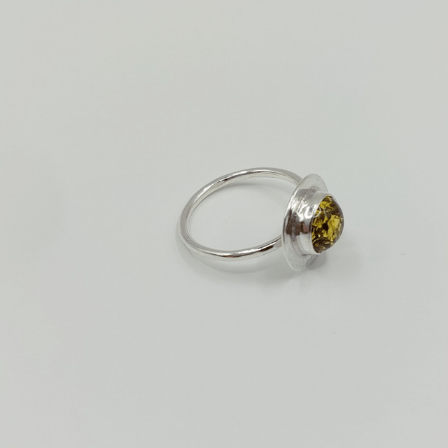 Sterling silver disc ring with green amber gemstone