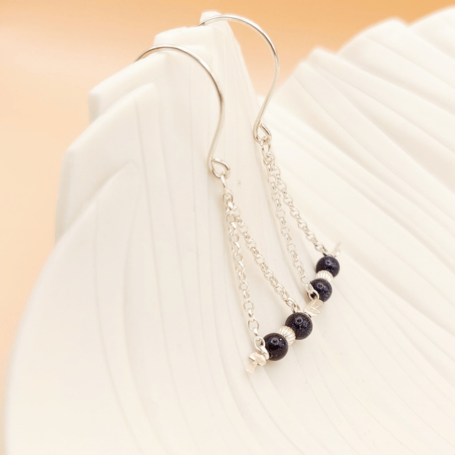 Sterling silver drop earrings with blue goldstone gemstone beads