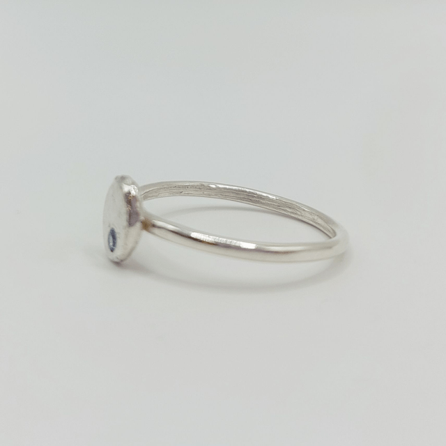 Hammered sterling silver disc ring with blue stone (size O)