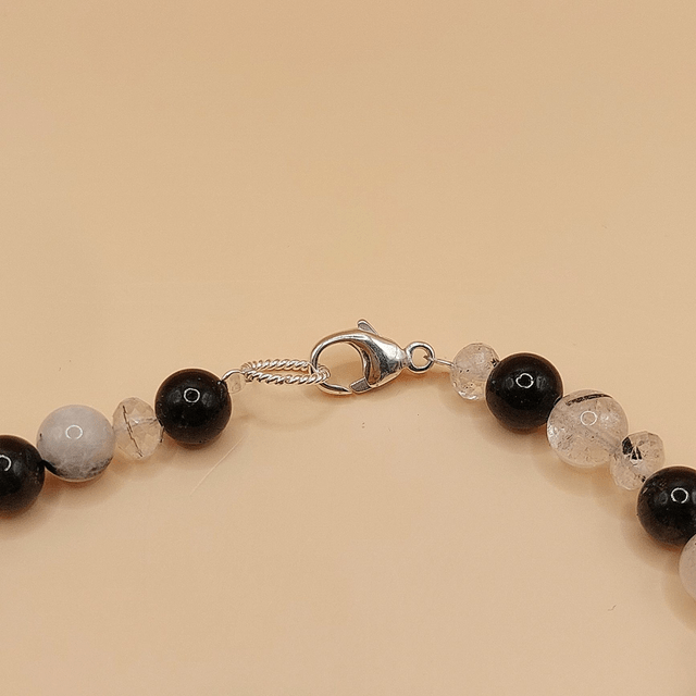 Lava (black), tourmalinated quartz and sterling silver beaded bracelet